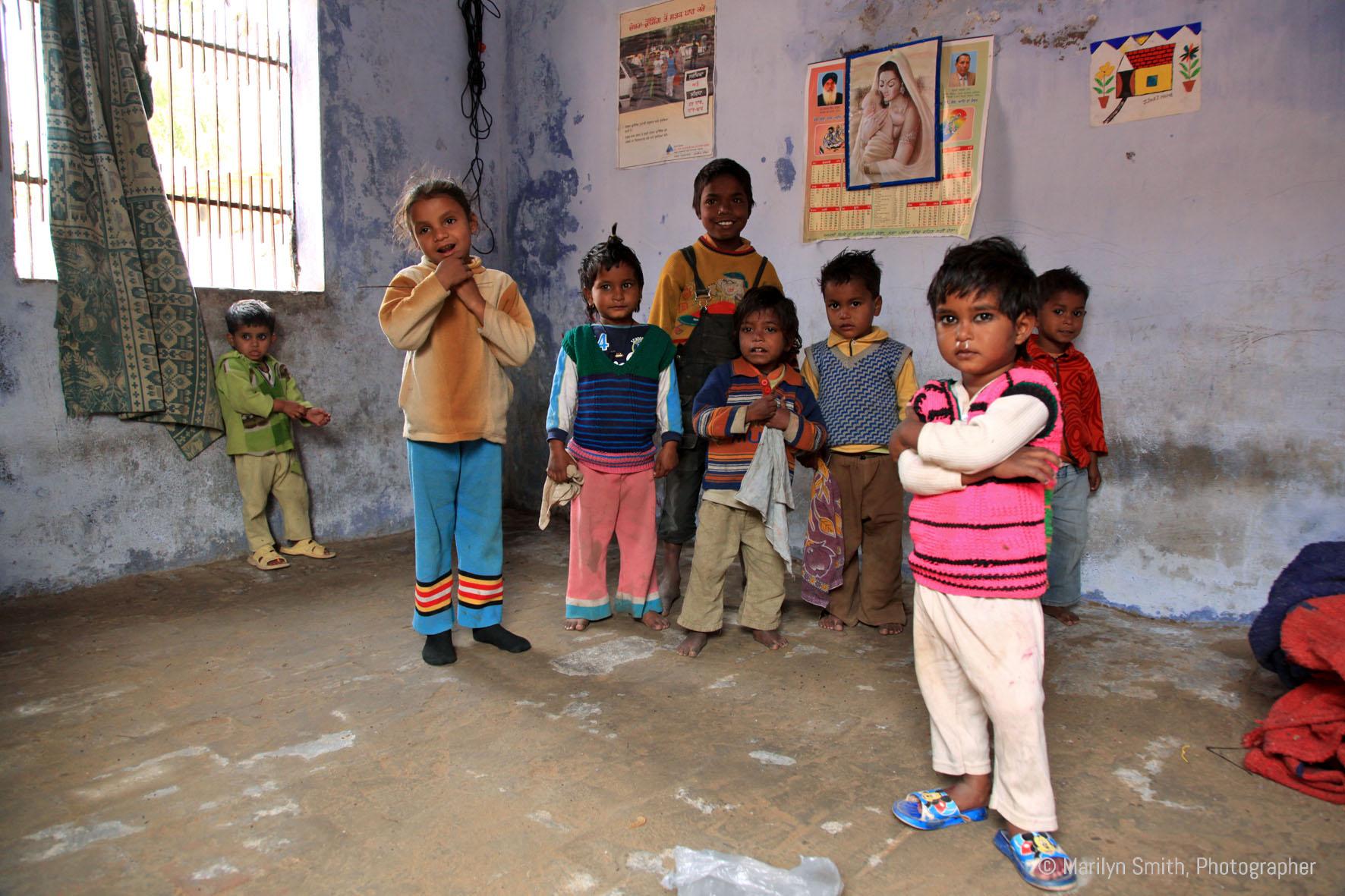 Students in a public school in Janta Colony with almost no books or resources.