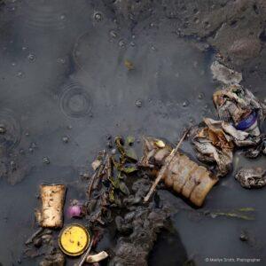 Garbage floating in a swamp in Janta Colony.