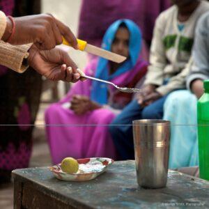 A DIR HP showing mothers how to make an oral rehydration solution.
