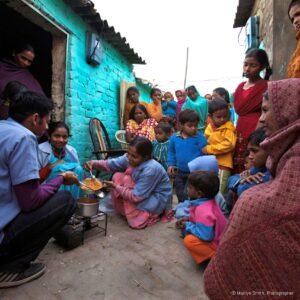 DIR HPs lead a cooking class in the street.