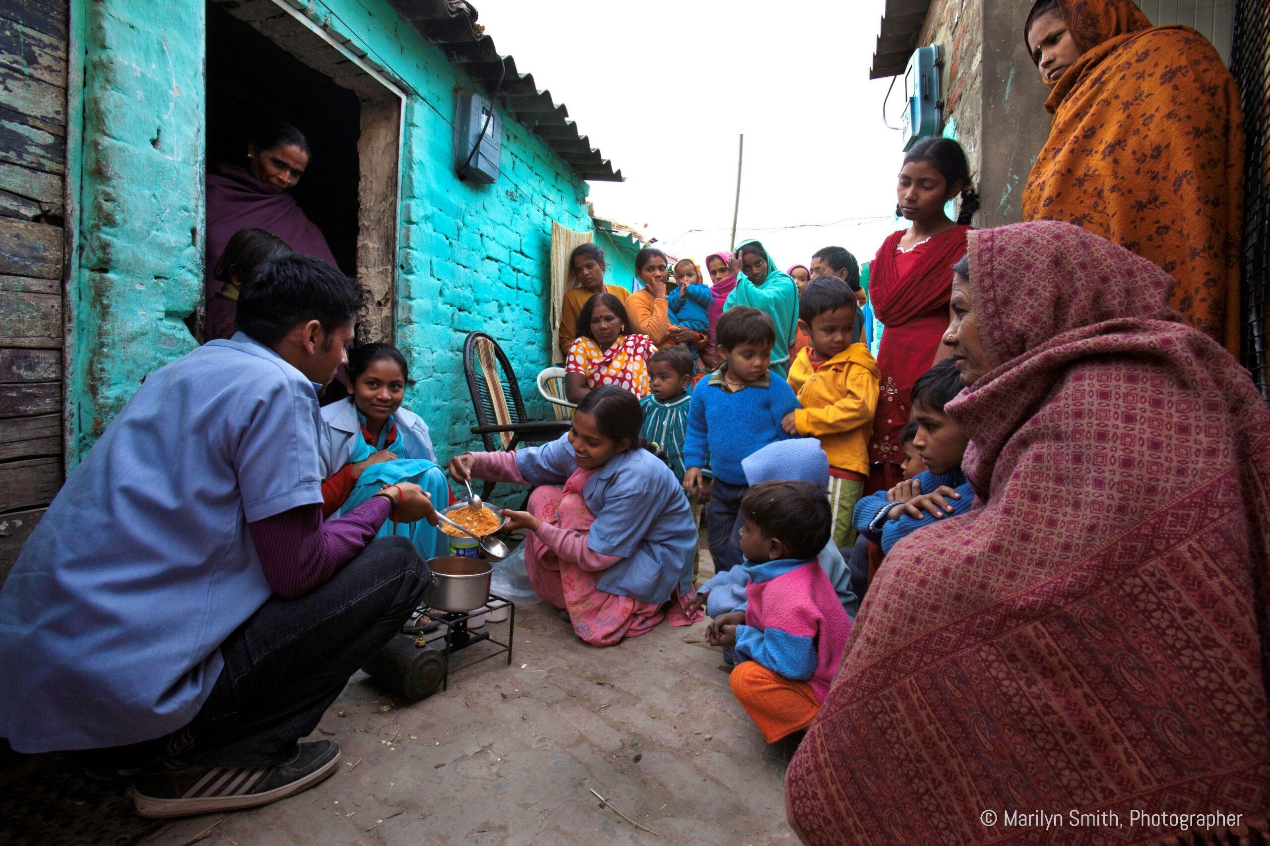 DIR HPs lead a cooking class in the street.