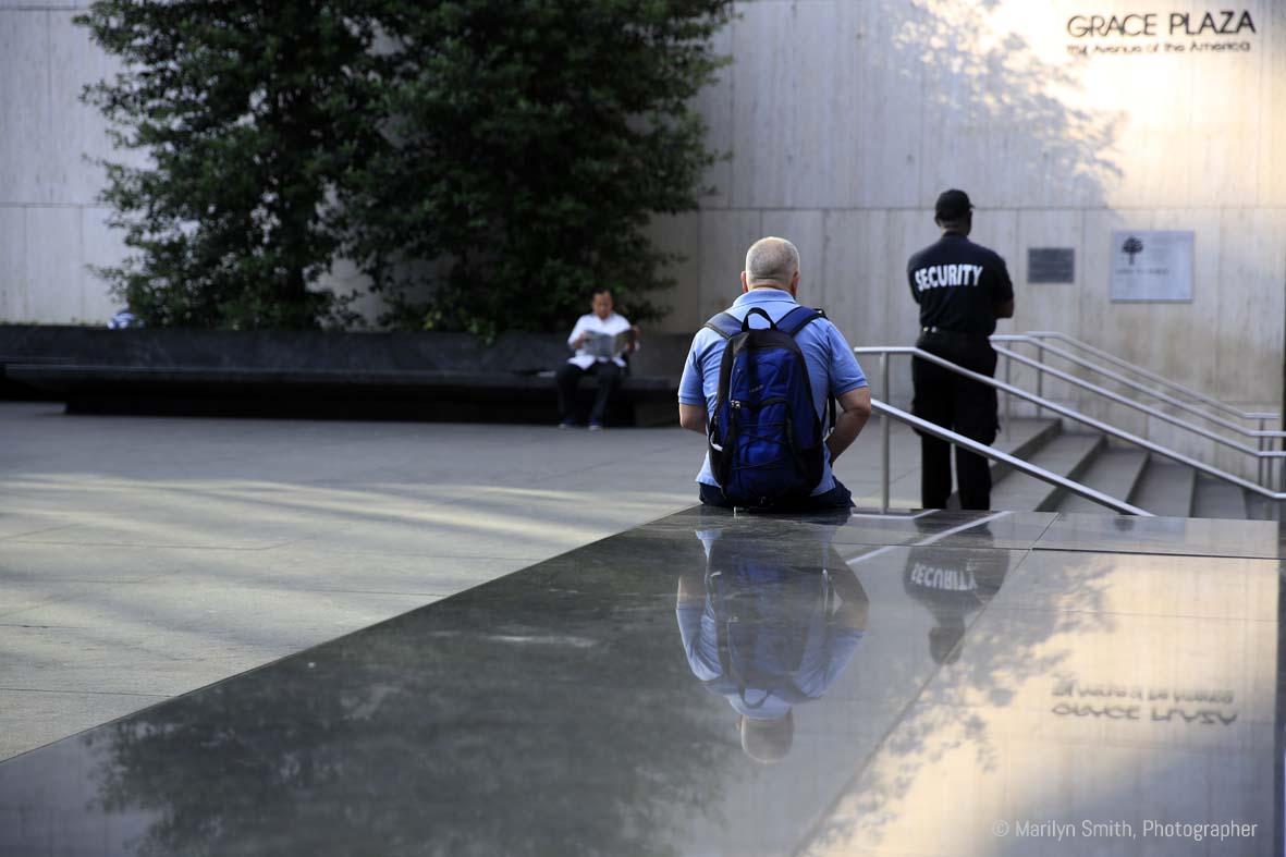 Grace Plaza, New York City, mid-afternoon, three people alone.